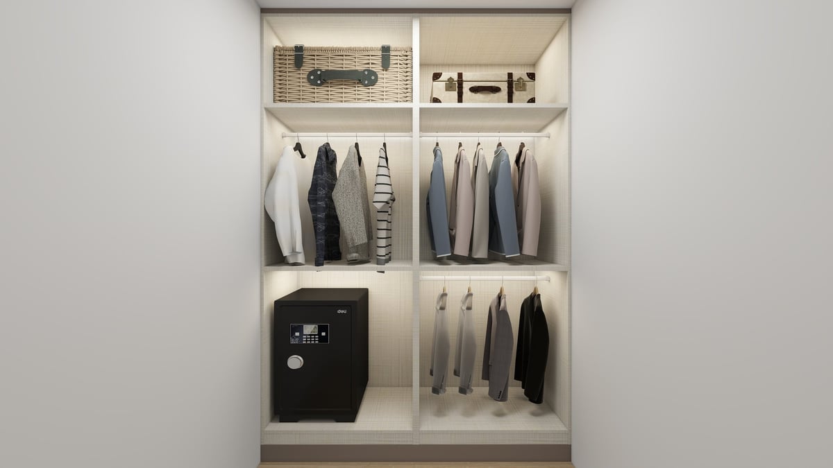 Organized closet shelving with storage baskets, hanging clothes in neutral tones, and a black safe or box compartment.