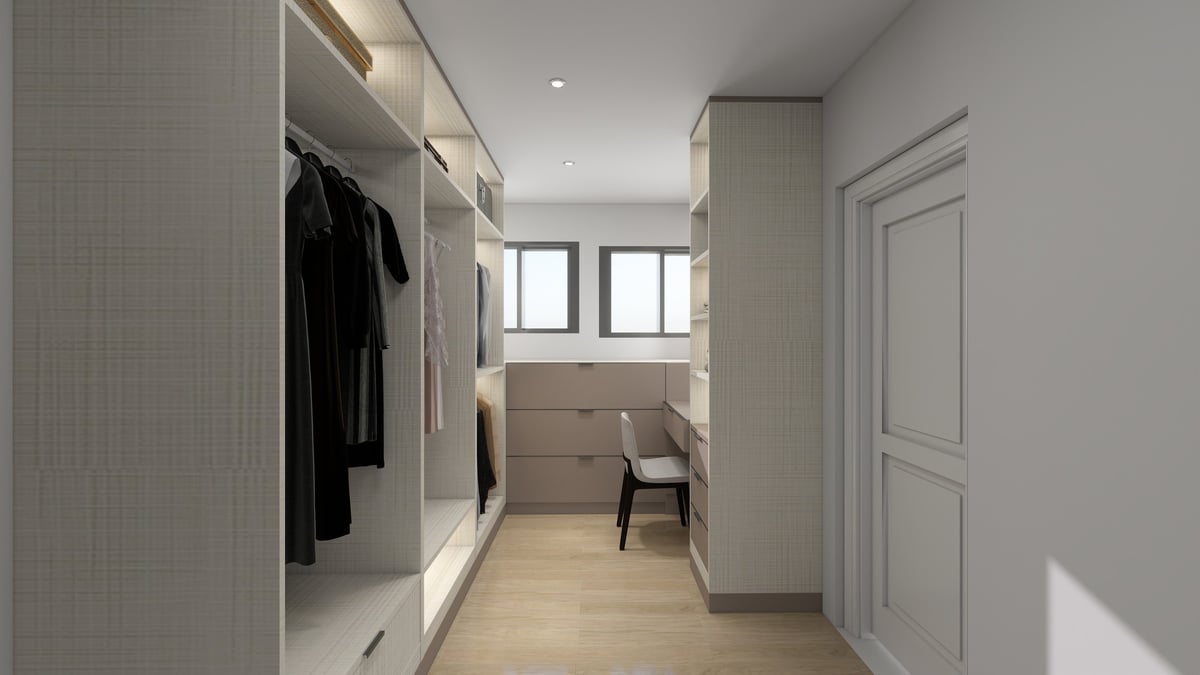 Modern walk-in closet with built-in wardrobes, white tile walls, wooden flooring, and a seating area with chair