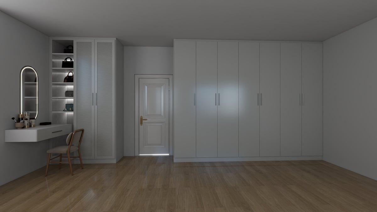 Modern bedroom interior with gray walls, wooden floor, built-in wardrobes, a vanity mirror with chair, and a doorway
