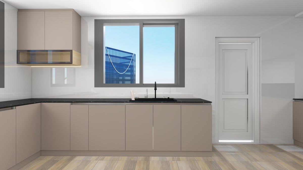 Modern beige kitchen with dark countertop, sink, upper cabinets, and large window overlooking city buildings