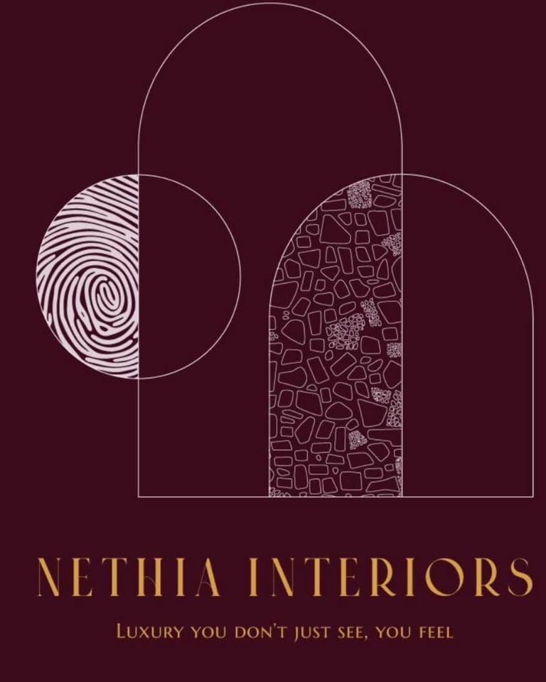 Nethia Interiors logo featuring geometric arch shape with fingerprint and tile pattern details in gold on burgundy background