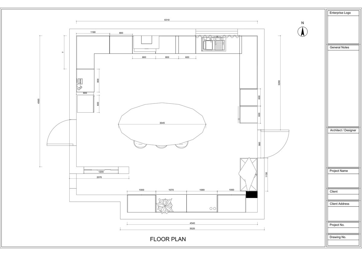 Architectural floor plan showing layout with central oval table, perimeter seating areas, kitchen, and restroom facilities