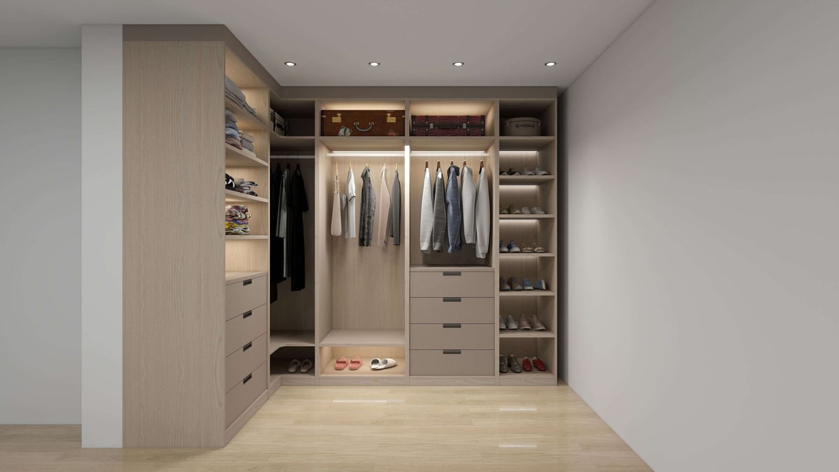 Modern walk-in closet with built-in wooden cabinetry, hanging rods for clothes, shelving, and drawers