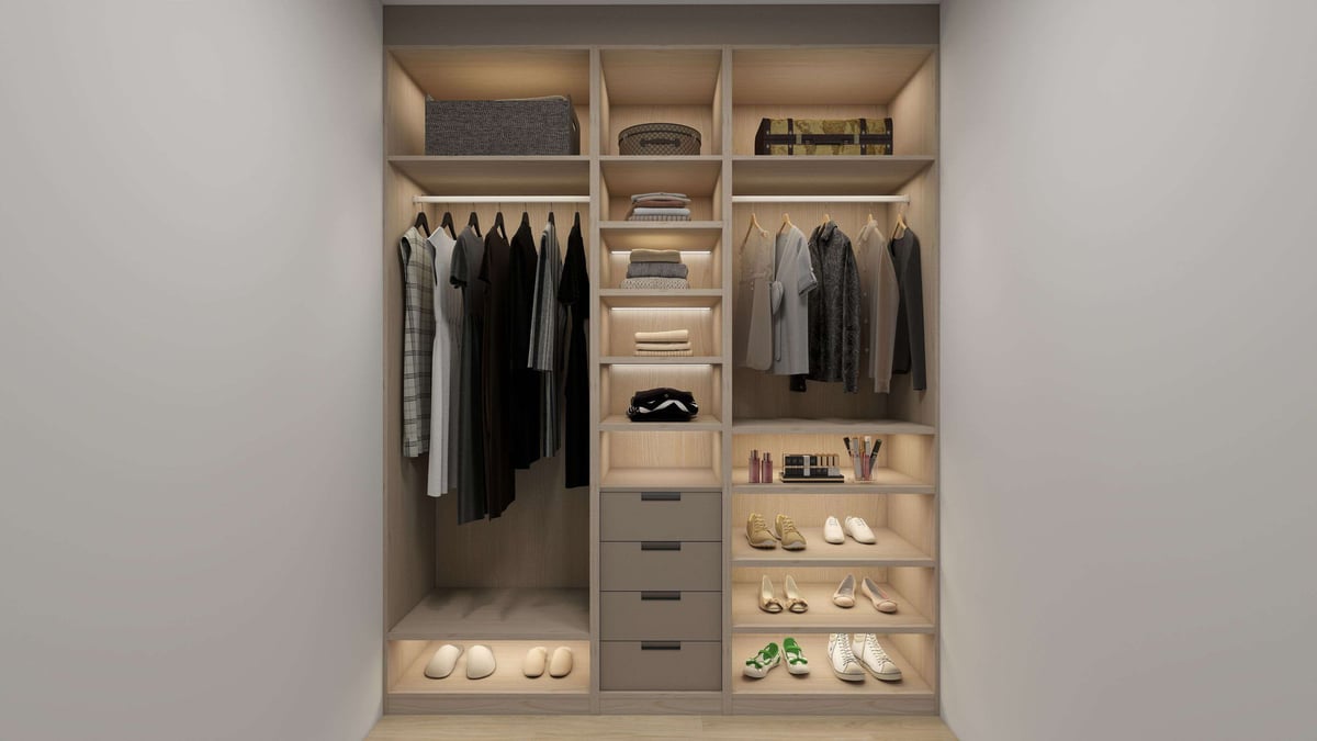 Modern closet with organized shelving, hanging clothes, drawers, and display areas for shoes and accessories