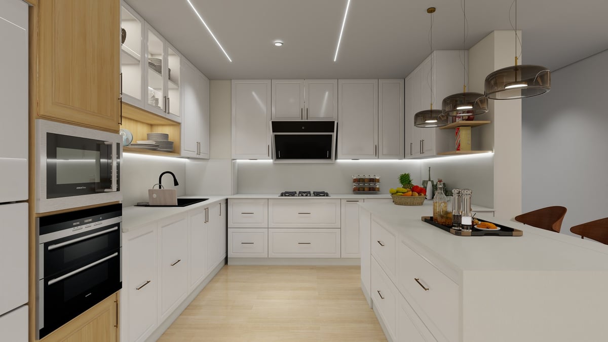 Modern kitchen with white cabinetry, wood accents, stainless steel appliances, and a light wood floor.