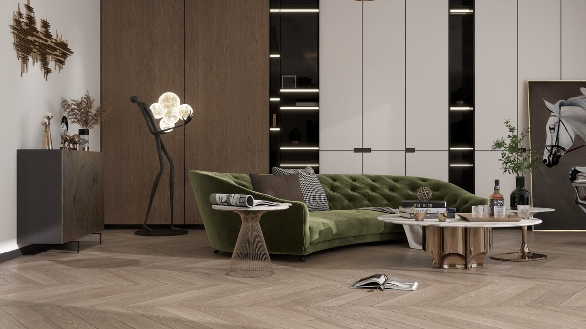 Modern living room with green velvet sofa, wood flooring, floor lamp with white sculptural shade, and minimalist furnishings