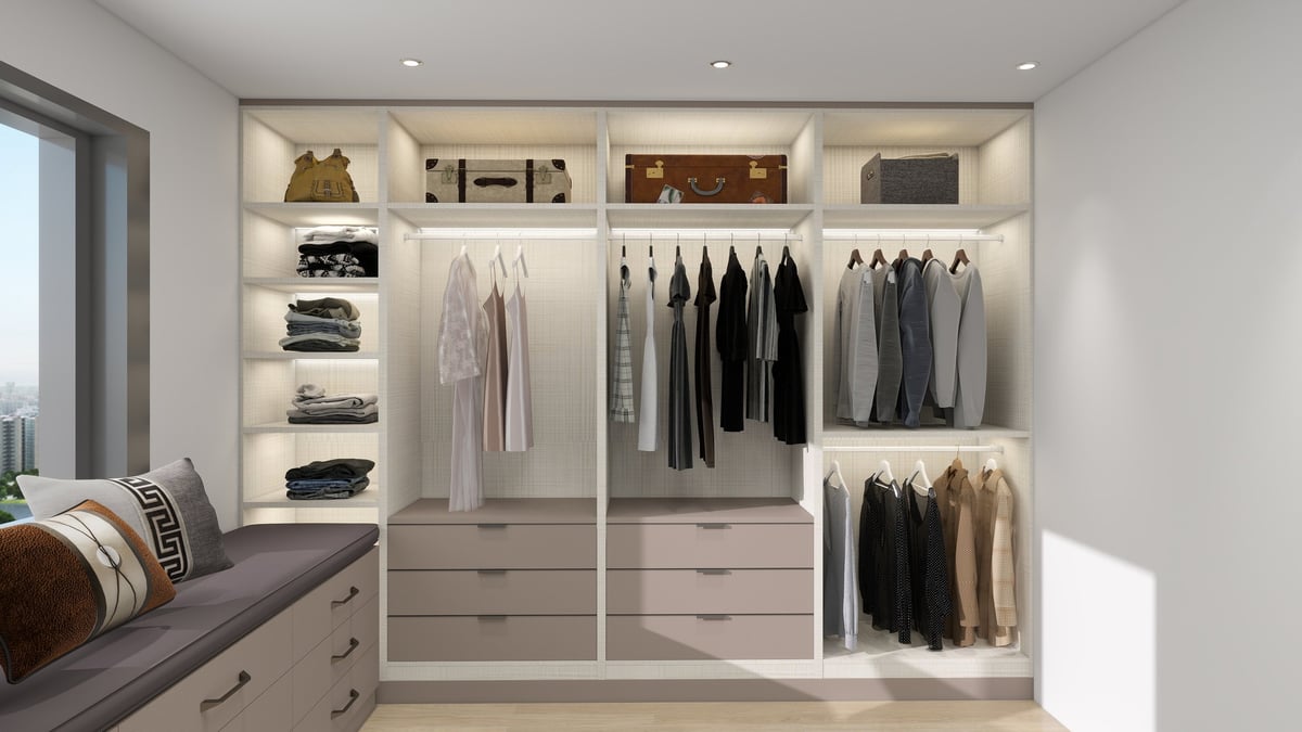 Modern walk-in closet with built-in shelving, organized clothing racks, drawers, and storage compartments displaying neatly arranged clothes and accessories