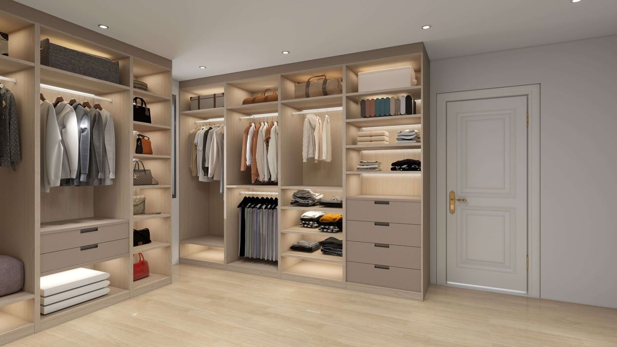 Modern walk-in closet with wooden built-in shelving, clothing racks, drawers, and organized storage compartments throughout