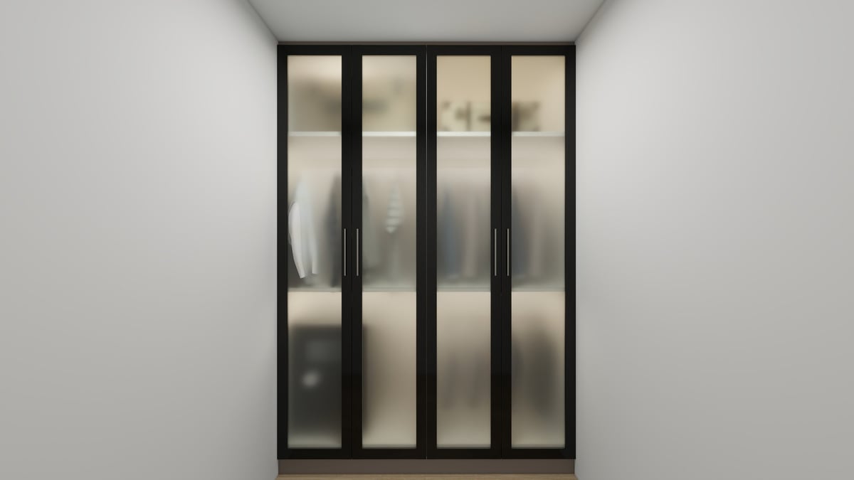 Modern black-framed glass sliding wardrobe doors mounted on white wall