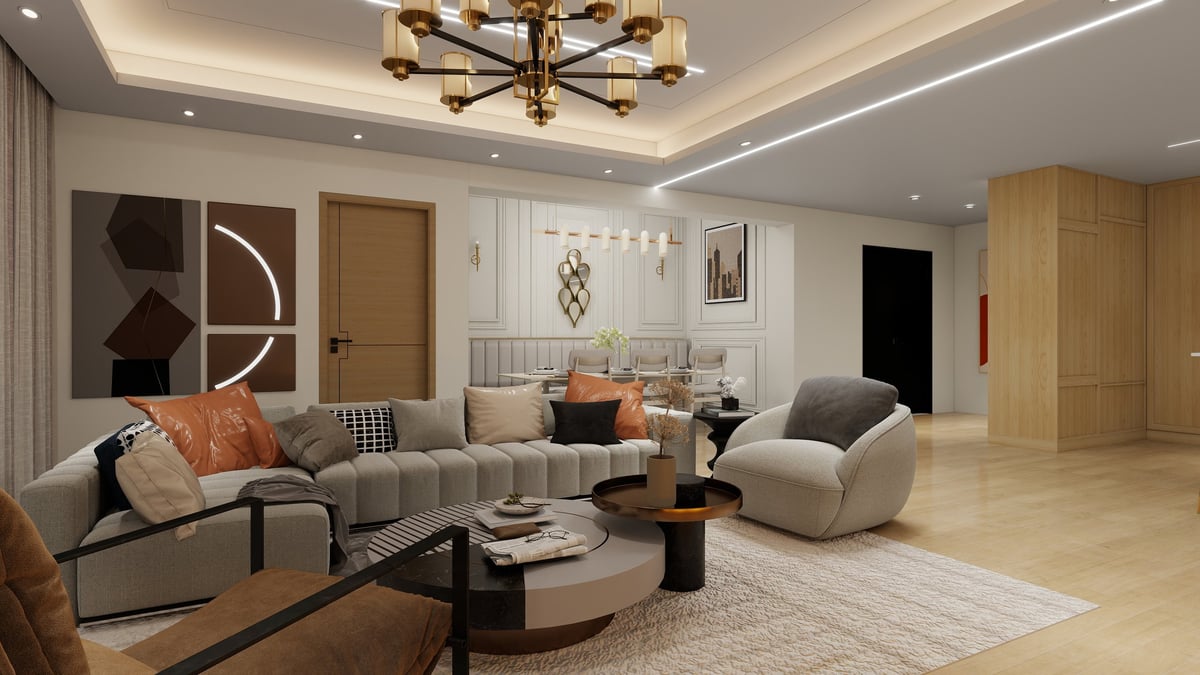 Modern living room with beige sectional sofa, white accent chair, round coffee table, and warm brass ceiling light fixture