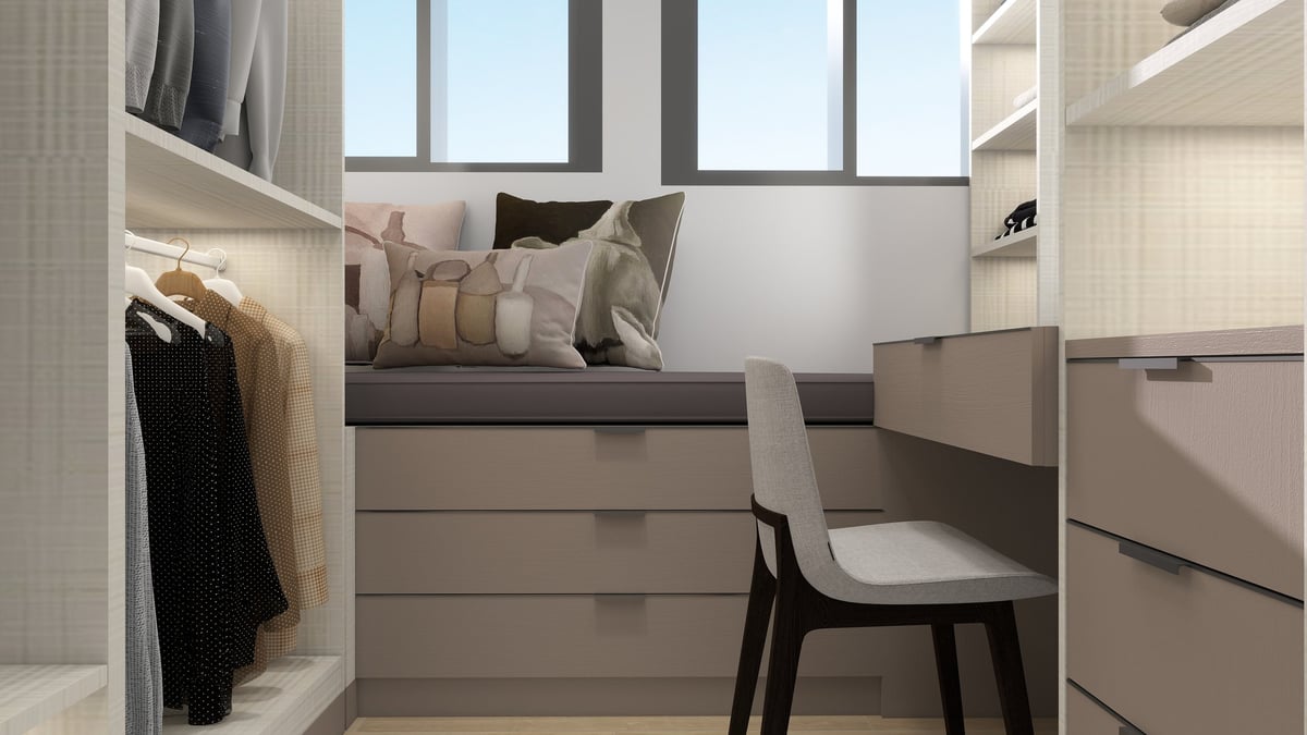 Modern bedroom with elevated bed featuring storage drawers, desk workspace, chair, clothing rack, and large windows.