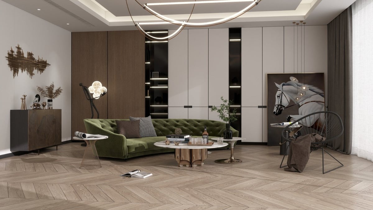Modern living room with green velvet sofa, white and brown cabinetry, herringbone flooring, and contemporary pendant lighting