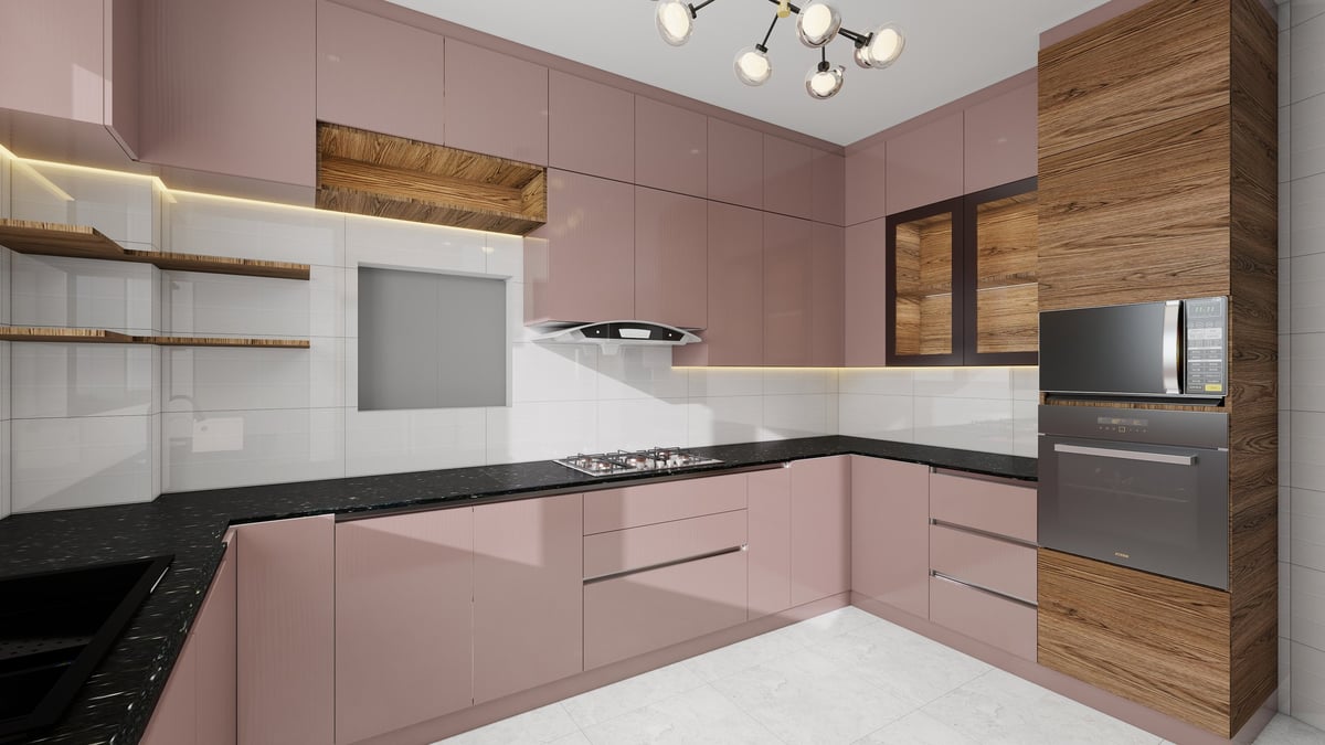 Modern kitchen with pink and wood cabinetry, black countertops, stainless steel appliances, and white backsplash